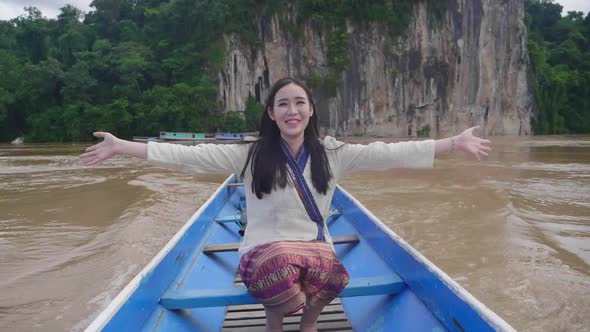 Happy Woman On Small Wooden Boat In The Mekong River