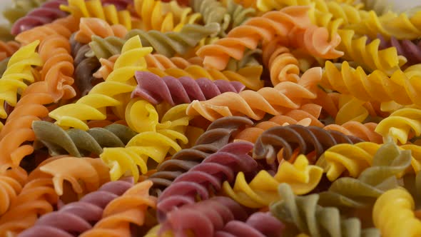 Colored italian fusilli raw pasta