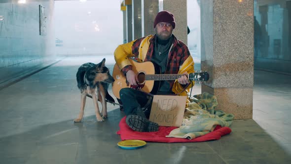 Underpass with an Almsman and His Dog Playing the Guitar