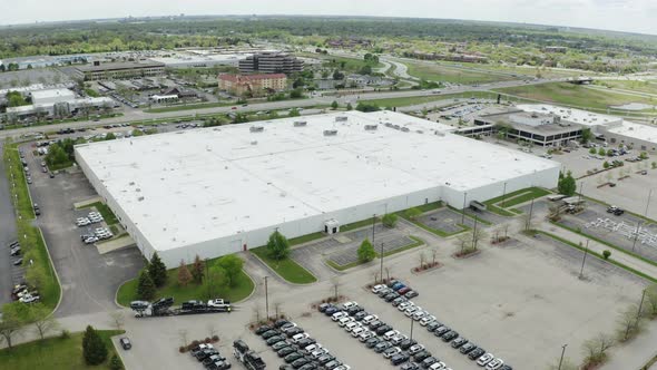 Aerial Drone Shot of the Car on Parking of the Dealer Lot and Car Carrier Trailer Car Hauler Loads