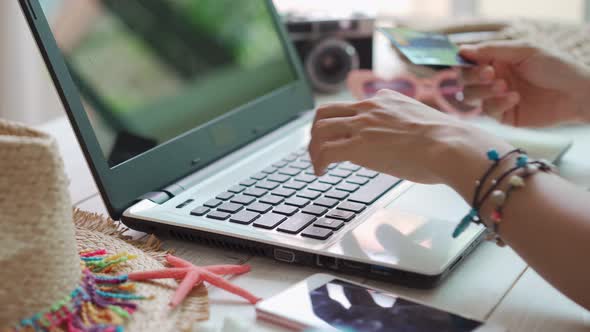 Young women planning summer vacation trip