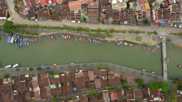 Aerial view of the river that cross the city, the houses and the boats in the small city Hot An, Vie