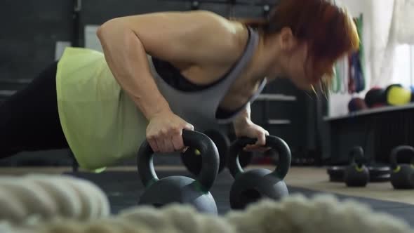 Muscular Woman Doing Push-Ups