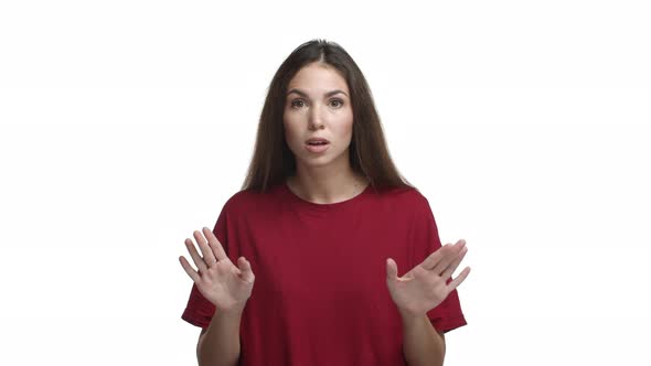 Attractive Brunette Female Model in Red Tshirt Trying to Warn you Shaking Head and Saying No