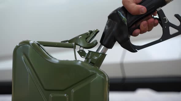 Filling Up a Jerrycan Fuel Container at a Petrol Station 22