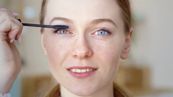 Confident Happy Young Woman Holding Mascara Apply on Eyeleashes Prepare Getting Ready in the Morning