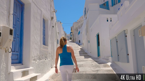 4K Following a Female Tourist Walking on Narrow Greek Island Street