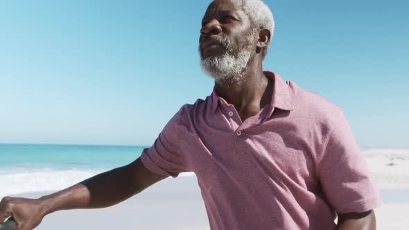 Senior man thoughtful at the beach