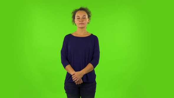 Curly Woman Standing Waiting with Boredom. Green Screen