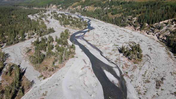 Aerial footage of a long, flat valley with the ghost river flowing through it. Wide angle tracking s