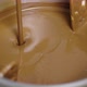 Jet of Melted Milk Chocolate Pours Into Smoll Mixer or Stirrer - VideoHive Item for Sale