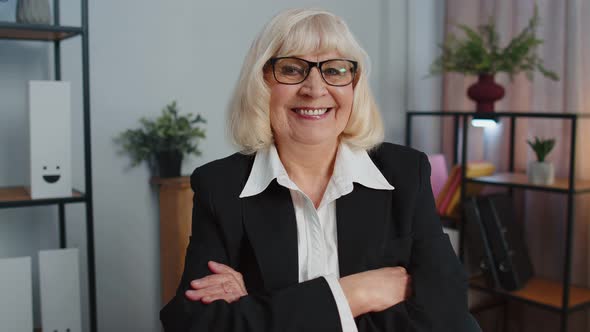 Cheerful Senior Mature Business Office Woman Wears Glasses Formal Suit Smiling Looking at Camera