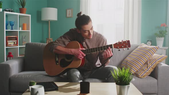 Young Man Is Streaming Guitar Playing