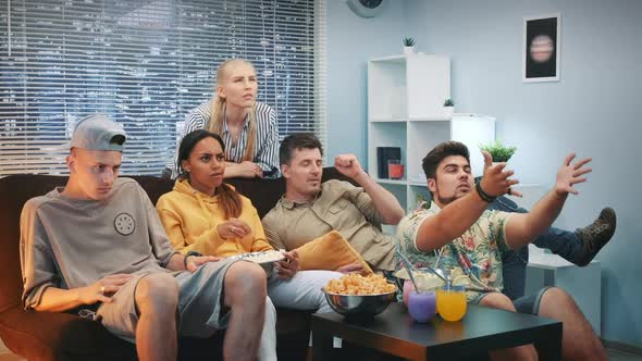 Group of Friends are Disappointed with Their Sport Team Play Watched on TV