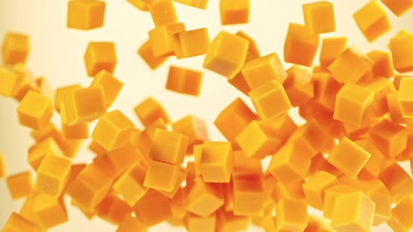 Super Slow Motion Shot of Flying Cheddar Cheese Cubes at 1000 Fps.