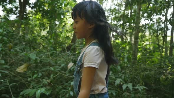 Kid Walking In Forest alt