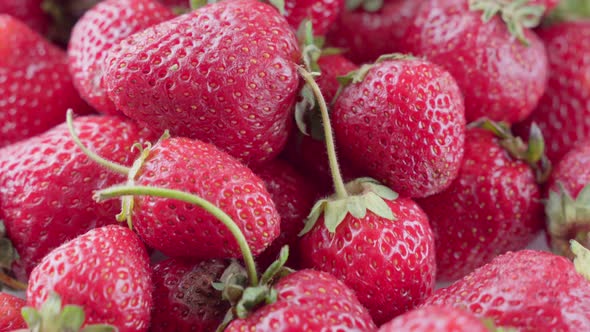 Ripe Red Strawberries with Green Leaves