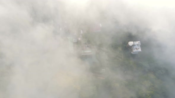 Morning Fabulous Fog That Covers the Mountains. Aerial Top View of Green Trees Covered with Thick