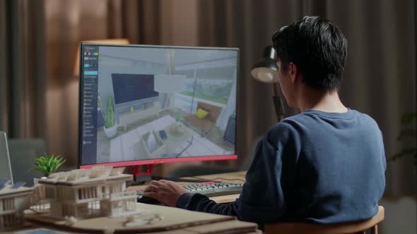 Asian Male Engineer Rotate And Zoom In 3D Room While Working On A Desktop At Home
