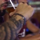 Closeup of a guy drinking a beer in a bar in Patagonia Argentina - VideoHive Item for Sale