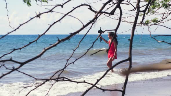 A Female Social Media Influencer Recording Travel Vlog at the Beach