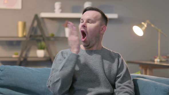 Portrait of Sleepy Casual Man Yawning