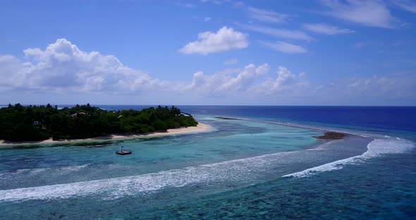 Tropical drone clean view of a white sandy paradise beach and aqua blue ocean background in colourfu
