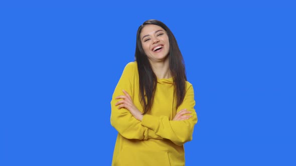 Portrait of Pretty Brunette Looking at the Camera and Laughing Cute