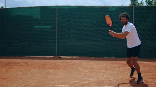 In a Sunny Day Good Looking Man Tennis Player