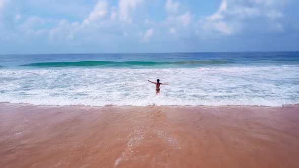 Asian Woman Feet Walking Barefoot Beach at Endless Ocean Seaside Leaving Footprints in Sand