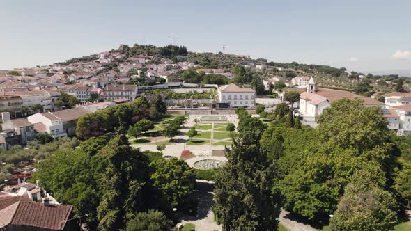 Empty municipal garden and Episcopal Palace in background, Castelo Branco in Portugal.