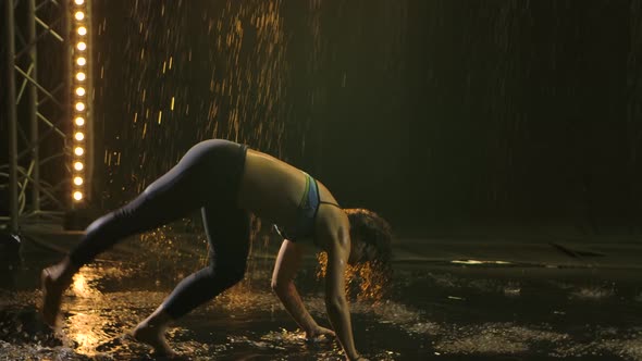 A Young Athletic Woman Performs Incredibly Difficult and Cool Capoeira Martial Art Movements at Dusk