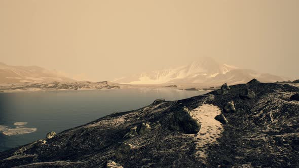 Coastline of Antarctica with Stones and Ice