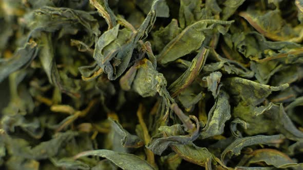 Closeup Dried Green Tea Leaves Rotating 360 Top View