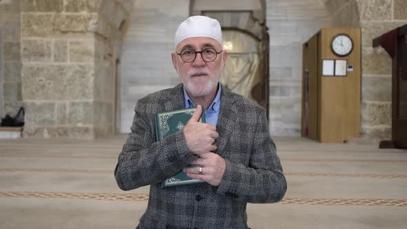 Old Man Holding Quran
