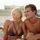 Teenage couple on a beach in sunlight - VideoHive Item for Sale