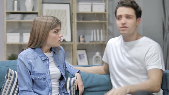 Angry Young Couple Yelling on Eachother During Argument at Home