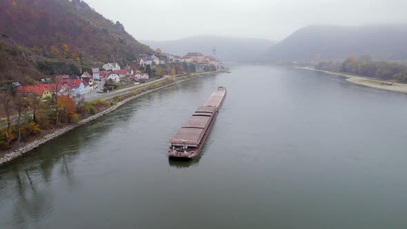 Cargo Pusher Boat on a River Transporting Cargo and Goods