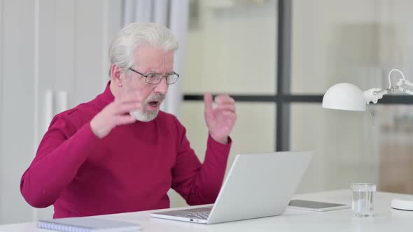 Old Man with Laptop Having Loss Failure