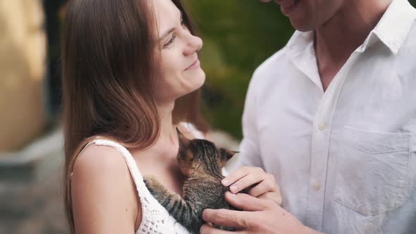 Close Up Slowmotion Video of Couple Play with Small Little Kitten