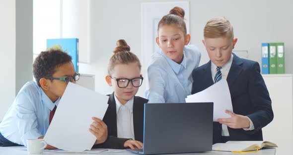 Young Diverse Businessmen at Board Meeting in Office