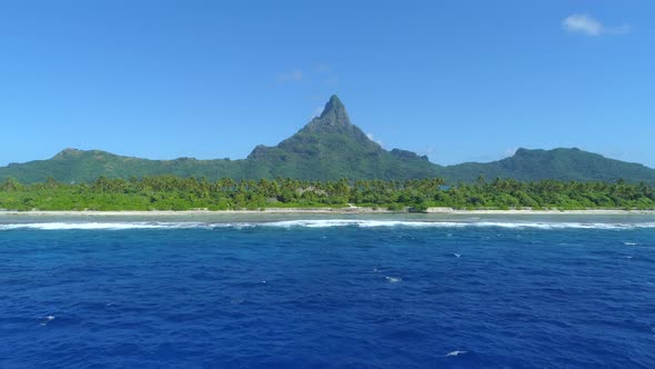 Aerial drone view Pacific Ocean, luxury resort and overwater bungalows, Bora Bora tropical island.