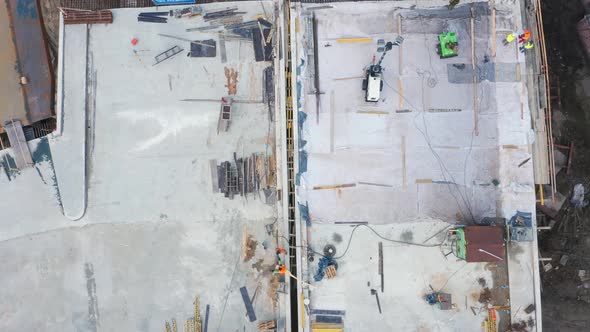 Aerial Top View of Workers Working on the Bridge Under Construction. Construction Work in