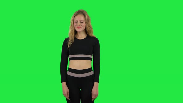 Blonde Girl Looking with Excitement, Then Smiling When Received Pleasant Information. Green Screen