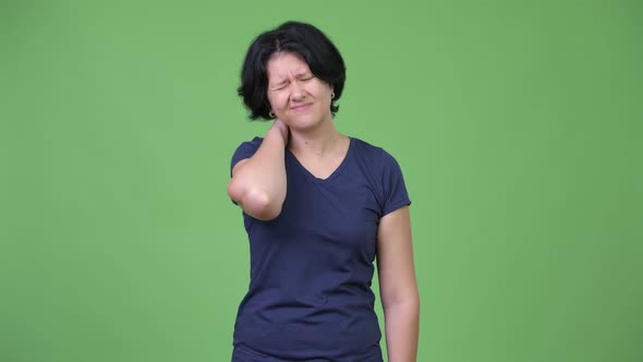 Stressed Woman with Short Hair Having Neck Pain