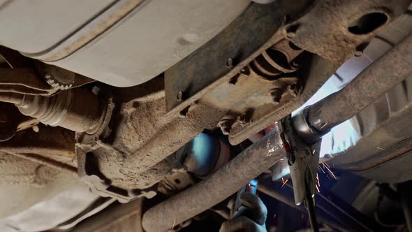 Welding Under the Bottom of an Old Rusty Car