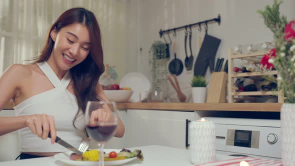 Asian young couple having dinner to celebrate valentine's day together.