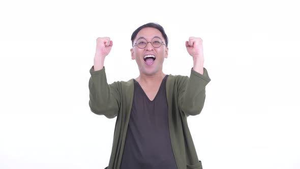 Happy Japanese Man with Eyeglasses Getting Good News