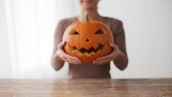 Close Up of Woman with Halloween Pumpkin at Home 22