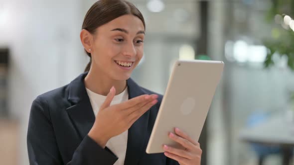 Portrait of Businesswoman Doing Online Video Chat on Tablet